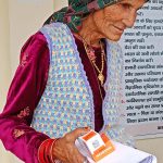 Free Medical Camp in Mayani, An elderly mother with her medicines after consultation with the doctor